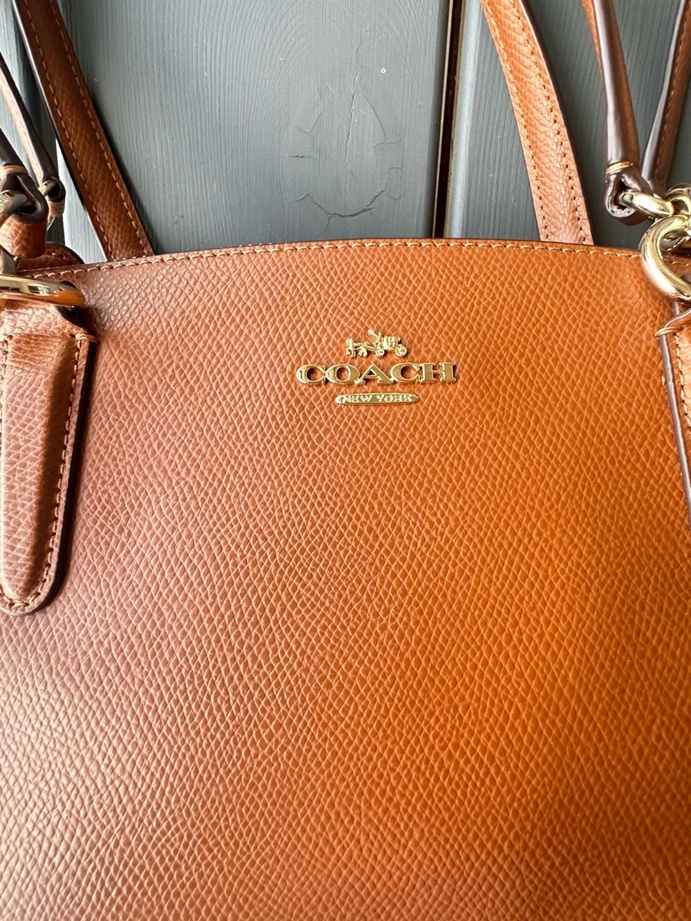 Coach Christie Carryall in a brown, textured leather with gold-tone hardware